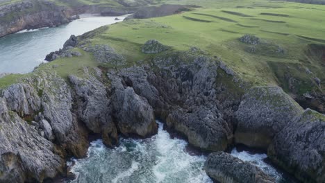 picturesque view of rocky cliff and sea against sky