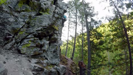 Rock-climber-climbing-a-cliff-4k