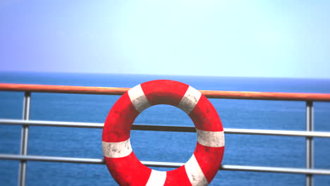 red lifebuoy on passenger ship in ocean