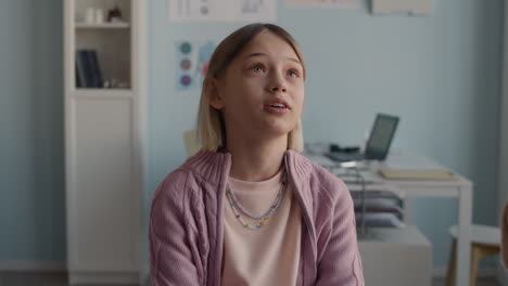 a doctor is examining a young girl in a medical office