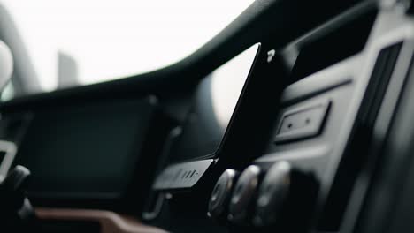 driver peeling plastic screen protector of a freightliner cascadia volvo 2023