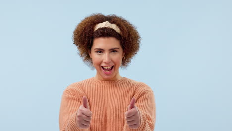 face, smile and thumbs up woman in studio