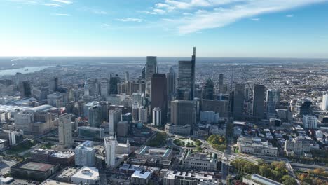 aerial footage of the skyline of downtown philadelphia showing the traffic on the highway and the morning clouds in the background