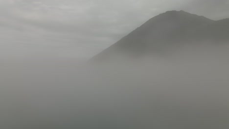 Foggy-Landscape-Over-The-Saint-Lawrence-River-And-Revealing-The-Chic-Choc-Mountain-Range-In-Quebec,-Canada