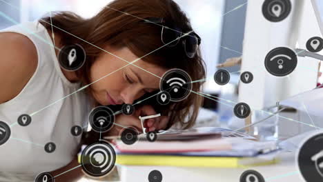 animation of network of connections with wifi icons over caucasian businesswoman sleeping