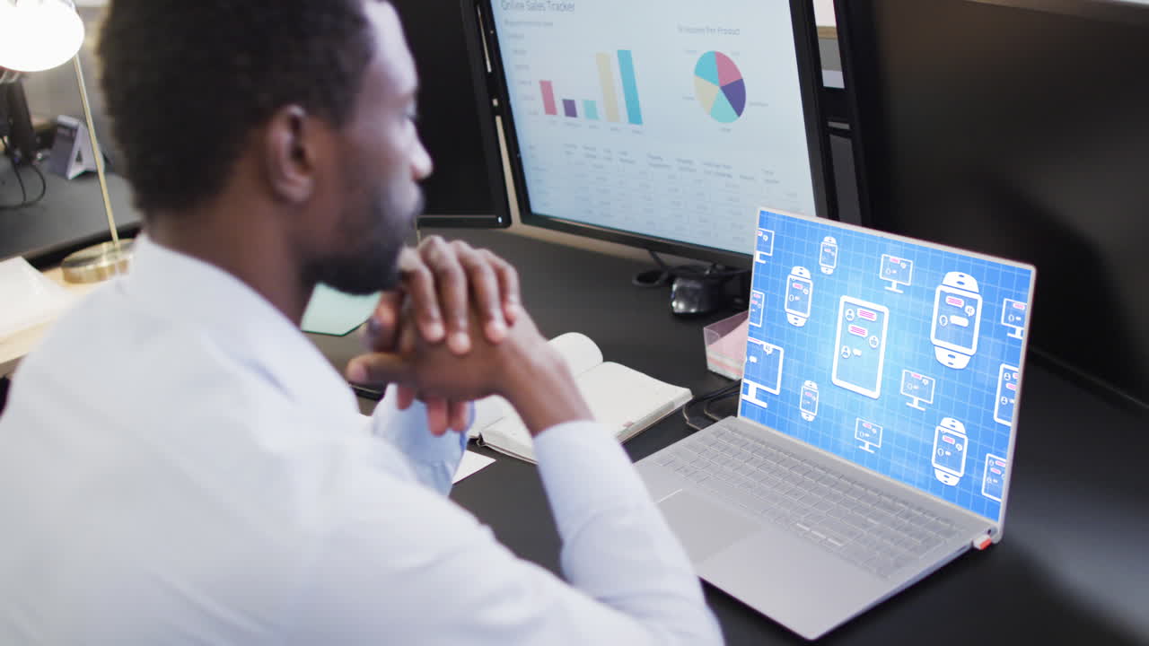 Composition of african american businessman using laptop with ai chat on screen