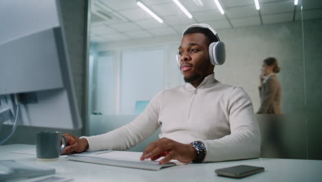 man working on computer in modern office