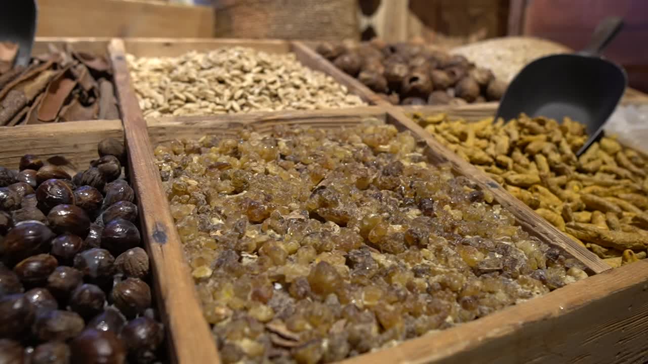 Dates, raisins, nuts for sale in an Arabian market or souq laid out in stalls.