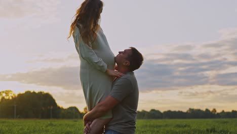future parents embrace the sunset