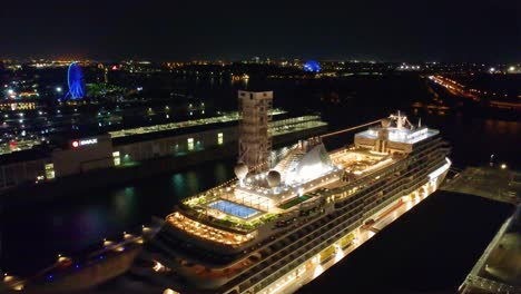cruise ship docked at night