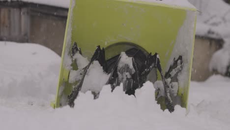 Watch-a-yellow-snowblower-in-slow-motion-as-it-clears-snow-from-sidewalks-and-driveways