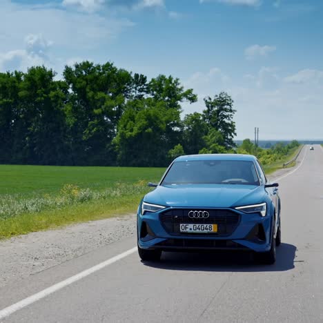 audi e-tron test drive. audi e-tron car moving on the highway
