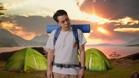 man camping at sunrise
