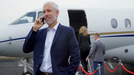 businessman talking on mobile phone at terminal 4k