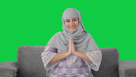 happy muslim woman greeting with namaste green screen