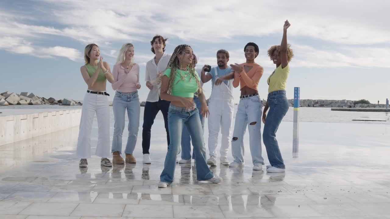 Group of Young Adults Dancing on Pier