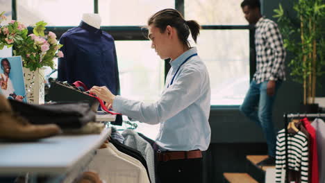 worker arranging stylish tie