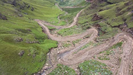 Drone-shot-of-Drakensberg-in-South-Africa---drone-is-flying-down-Sani-Pass-and-revealing-the-mountains