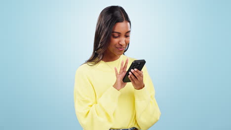 Phone,-networking-and-young-woman-in-studio-typing