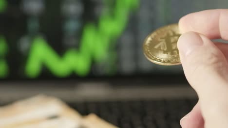 white hands hold bitcoin golden goin, stock market graphic green line going up background, financial technology, cryptocurrency concept, close up shot