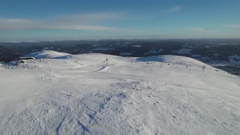 epic winter landscape view of ski slope in trysil norway - dolly shot