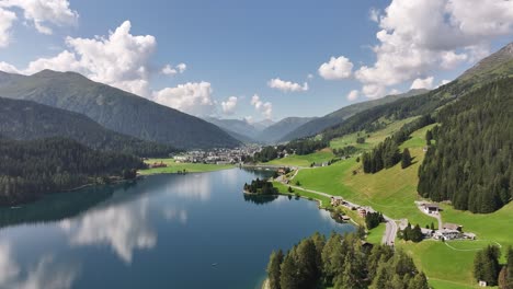 aerial - davos lake surrounded by alpine mountains, switzerland