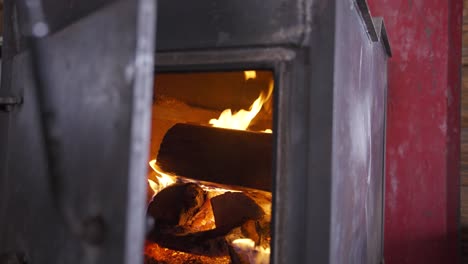 fireplace inside a cabin on a snowy day