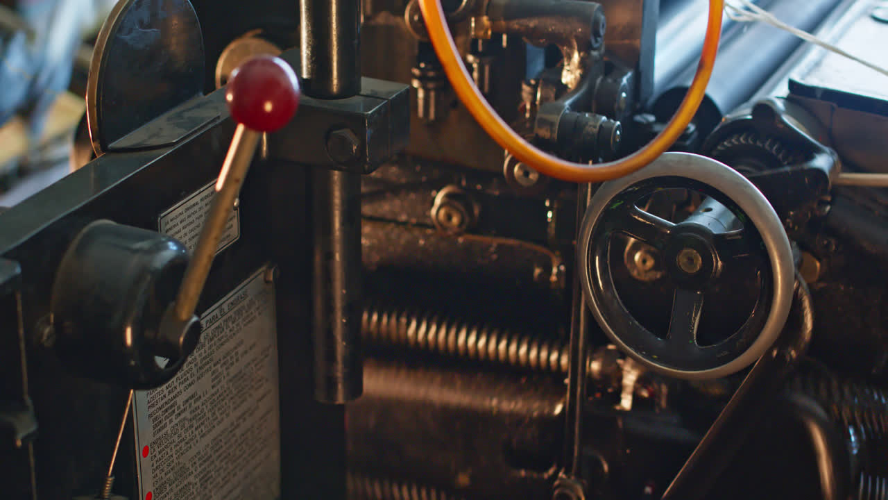 Close-up of Old Printing Press Machinery in Operation