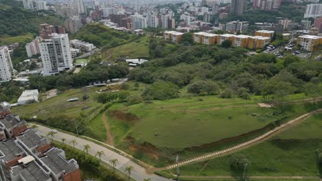 Drone-pull-back-view-of-the-Aguactal-neighborhood-in-the-western-part-of-Cali,-Colombia