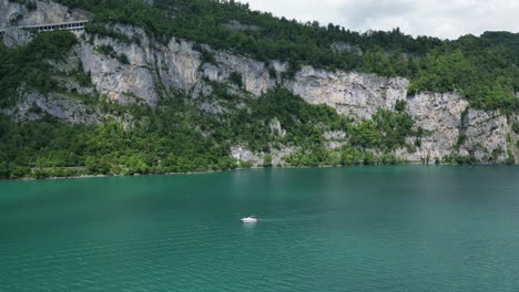 Sailing-boat-on-Lake-water,-Walensee-Glarus,-Weesen-Walenstadt,-Switzerland--drone-view