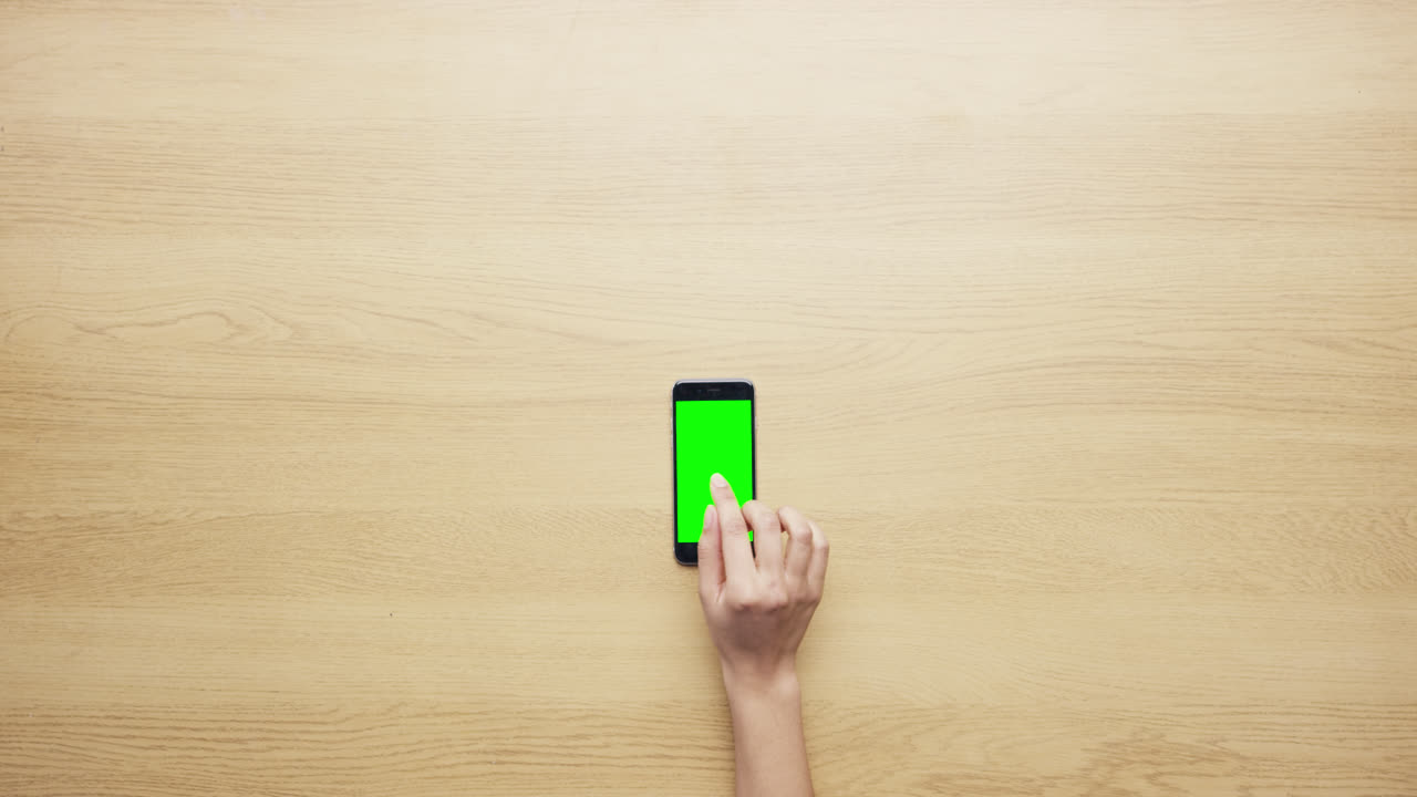 Top view female hands showing multitouch gestures green screen working at desk from above - Red Epic Dragon