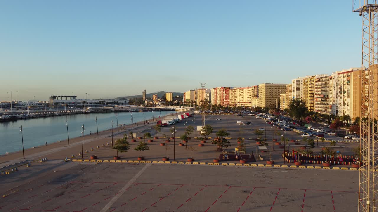 Witness the majestic sunrise over the bustling port of Algeciras, a jewel of Andalusia, Spain, in this breathtaking aerial view.