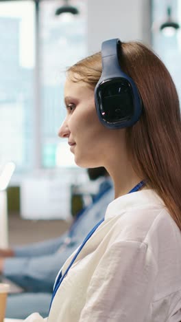vertical video junior dev developing ai software applications, optimizing code, listening music
