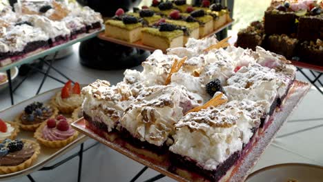 dessert table featuring a flaky pastry with a fruity base