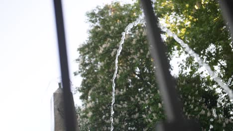 Moving-shot-of-fountain-behind-fences