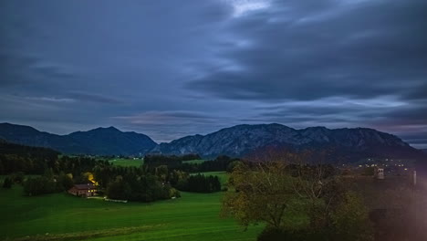 colorful timelapse of the night falling over the austria alps in summer time