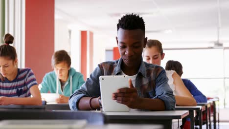 students using digital tablets in classroom