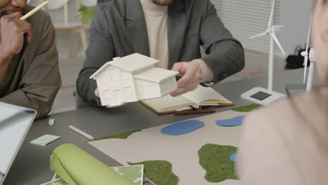 businessman explaining renewable energy project to colleagues in the office