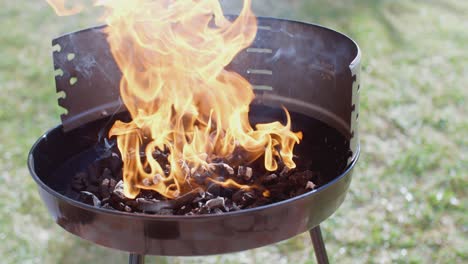 blazing fire in a portable barbecue