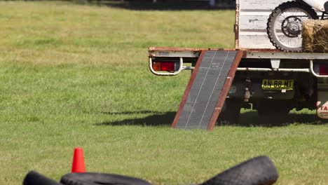 motorcycle driven up ramp into pickup truck