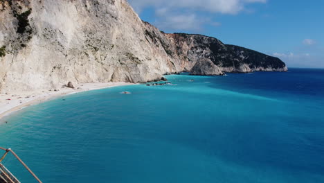 A-derelict-concrete-staircase-reveals-the-massive-beachside-cliffs-in-Lefkada,-Greece