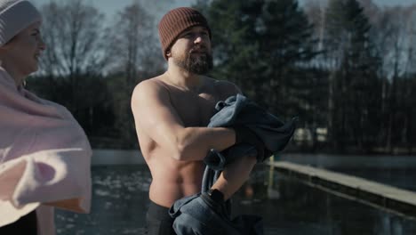 Caucasian-man-and-woman-using-towels-after-going-out-of-cold.