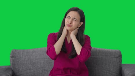 Sick-Indian-woman-suffering-from-neck-pain-Green-screen