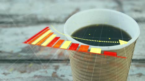 Animation-of-arrow-on-falling-bar-graph-over-overhead-view-of-coffee-cup-on-wooden-table