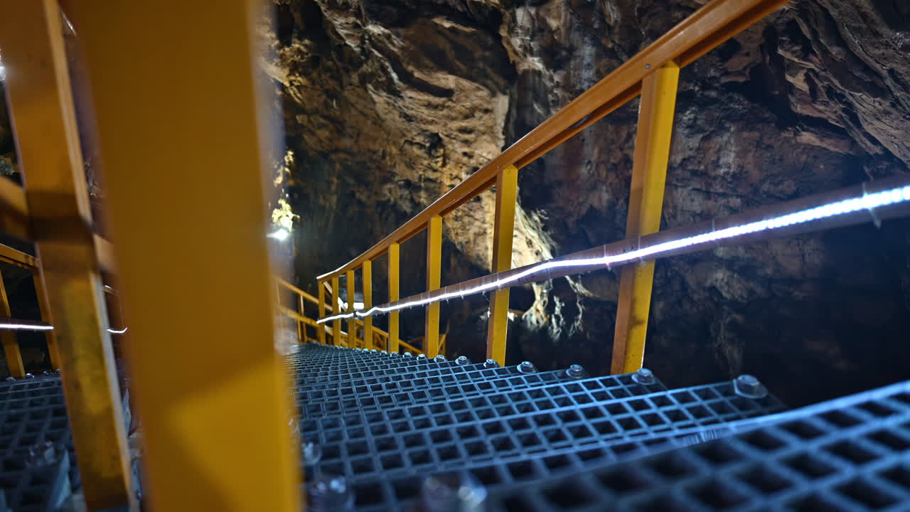 Stairs and rails inside of the Ialomita Cave in the Bucegi Mountains in Romania