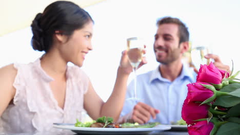 Happy-couple-celebrating-their-anniversary-with-champagne