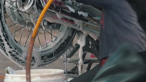 Close-Shot-of-Cleaning-a-Motorbike