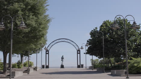 statue of george rogers clark in louisville, kentucky on the riverfront at plaza belvedere with a pan right to reveal a city fountain