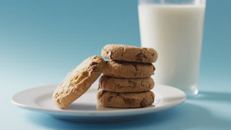 Video-of-biscuits-with-chocolate-and-milk-on-blue-background