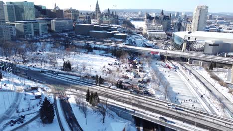 Forward-aerial-overview-of-wintertime-Ottawa-during-trucker-protests